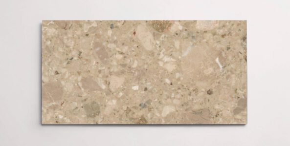 A single brown terrazzo marble tile with various sized aggregates throughout
