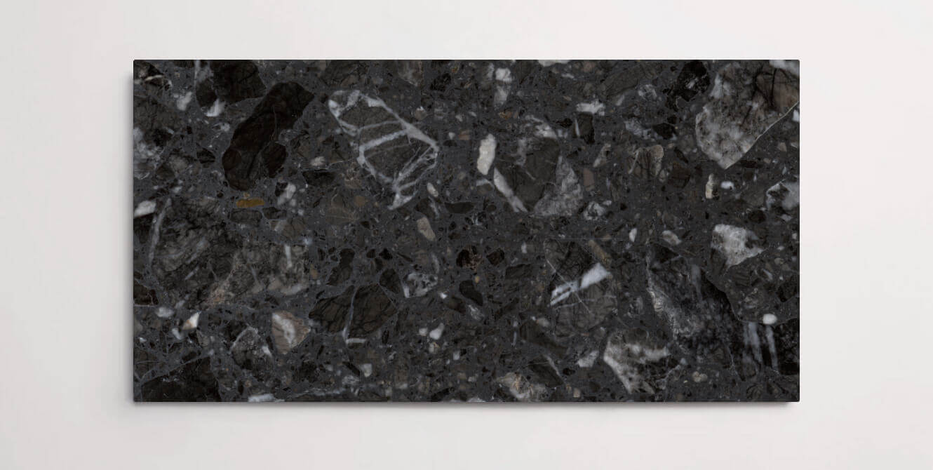 A single dark grey terrazzo marble tile with various sized aggregates throughout
