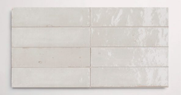Eight stacked 2.25" x 9.5" white wall tiles in a glossy finish