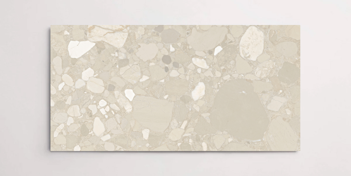 A single beige porcelain tile with a terrazzo marble look