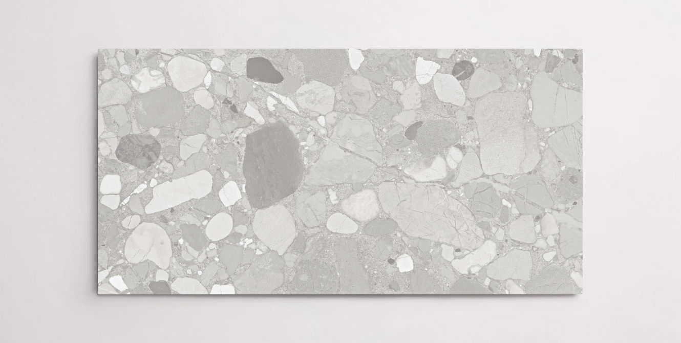 A single grey porcelain tile with a terrazzo marble look