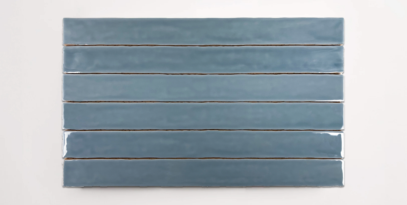 Six stacked 2" x 20" blue ceramic tiles in a glossy finish