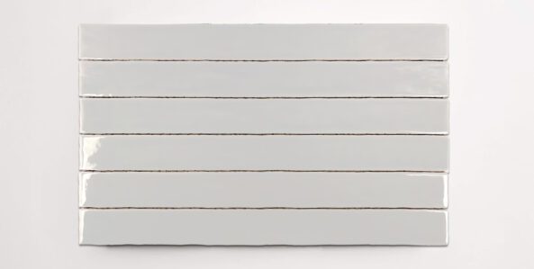 Six stacked 2" x 20" white ceramic tiles in a glossy finish