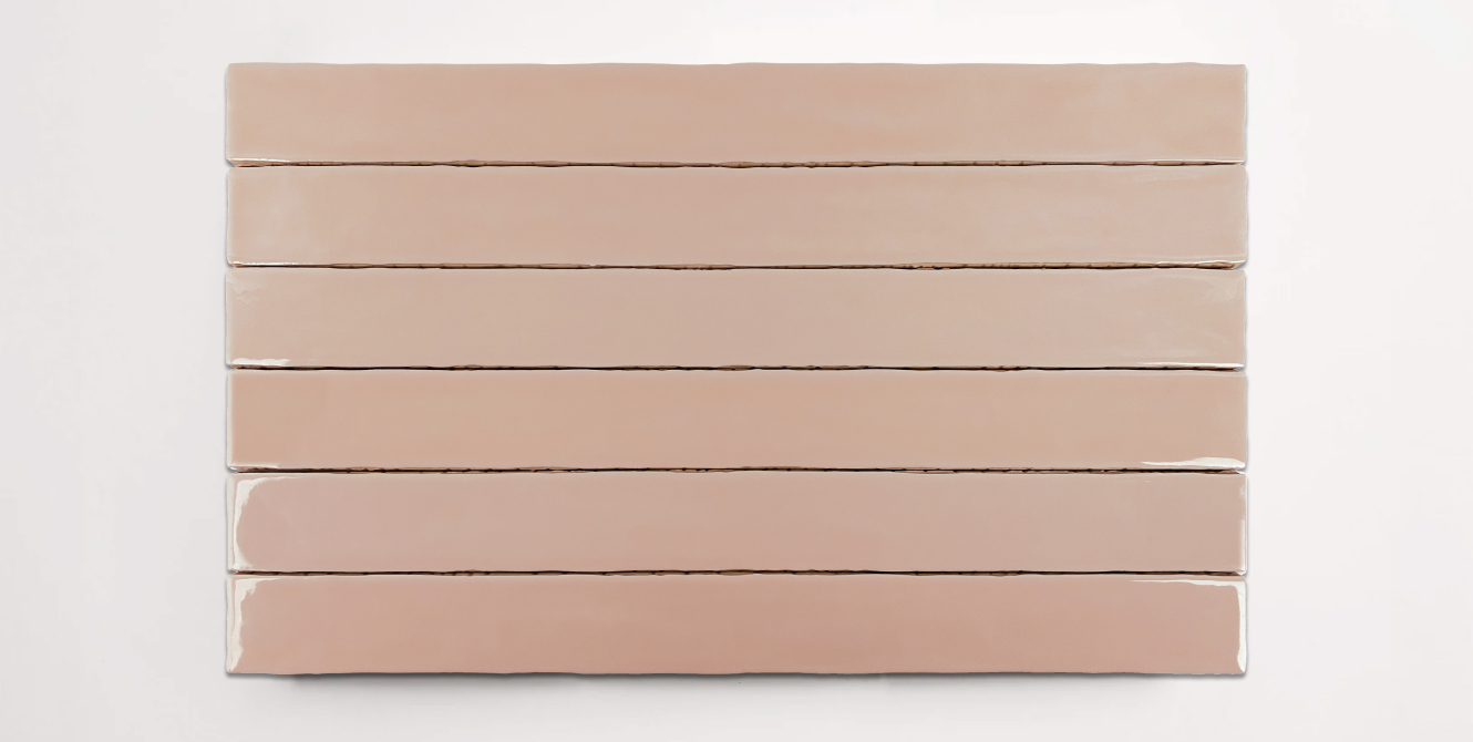 Six stacked 2" x 20" ceramic tiles in a light pink color