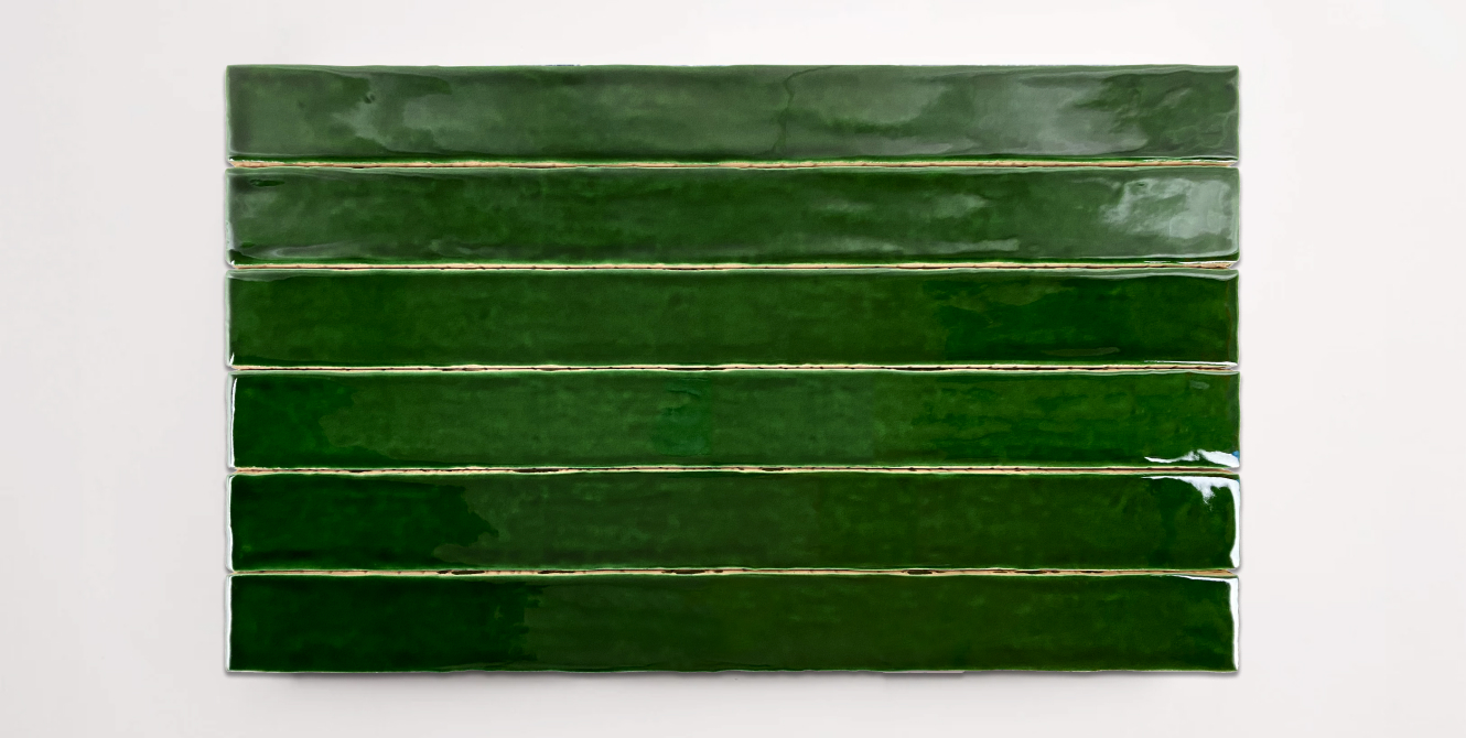 Six stacked 2" x 20" ceramic tiles in a deep green color
