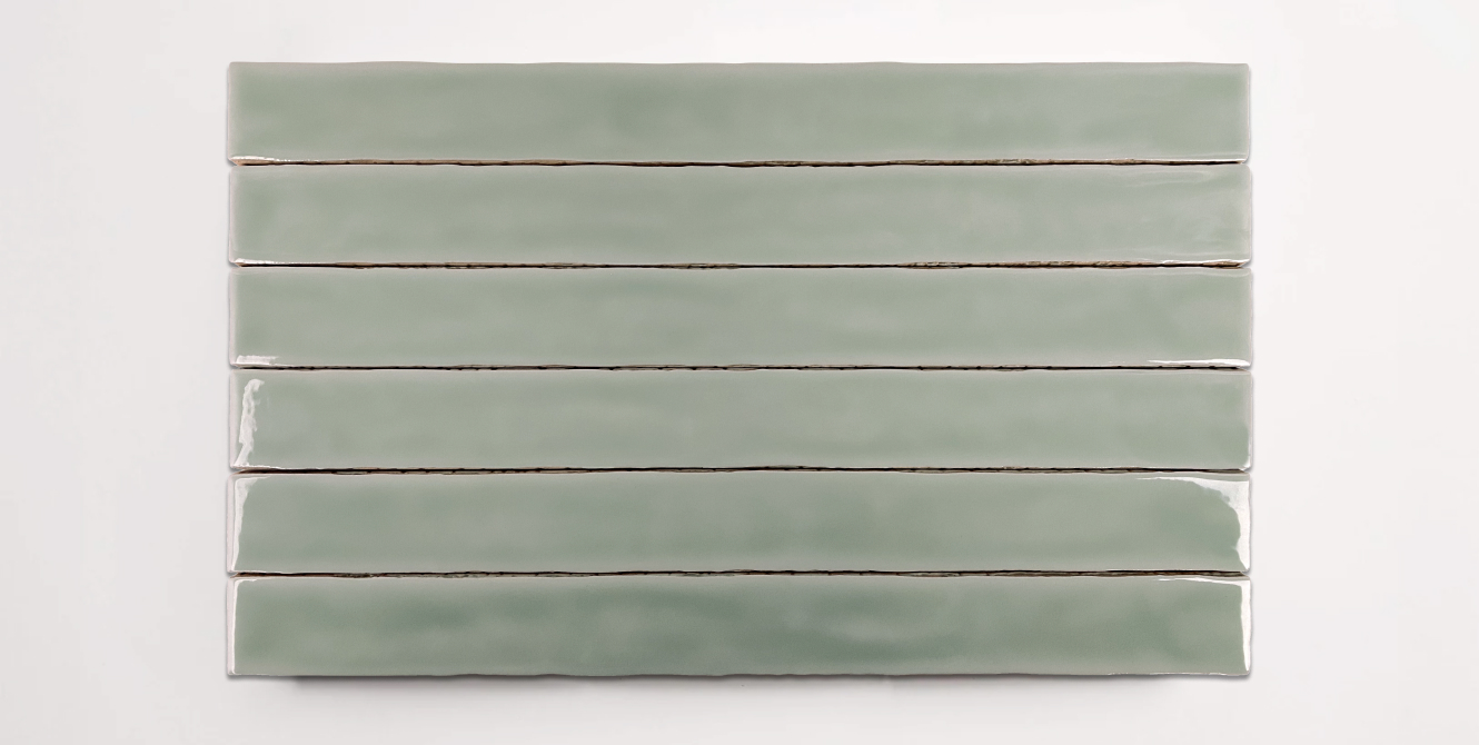 Six stacked 2" x 20" ceramic tiles in a light green color