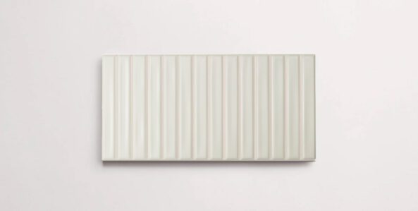 A single white porcelain tile in a matte finish