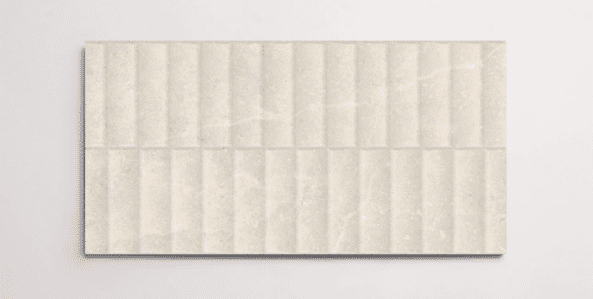 A single cream 10" x 30" stone-like porcelain tile with a textured blind pattern and subtle veining