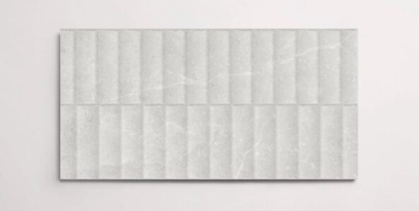 A single white 10" x 30" stone-like porcelain tile with a textured blind pattern and subtle veining
