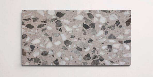 A single grey terrazzo marble tile with various sized aggregates throughout