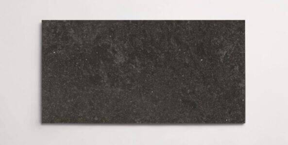 A single black terrazzo marble tile with subtle aggregates throughout