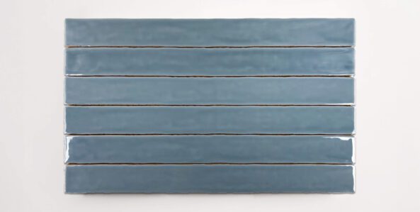 Six stacked 2" x 20" blue ceramic tiles in a glossy finish