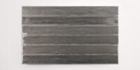 Six stacked 2" x 20" dark grey ceramic tiles in a glossy finish