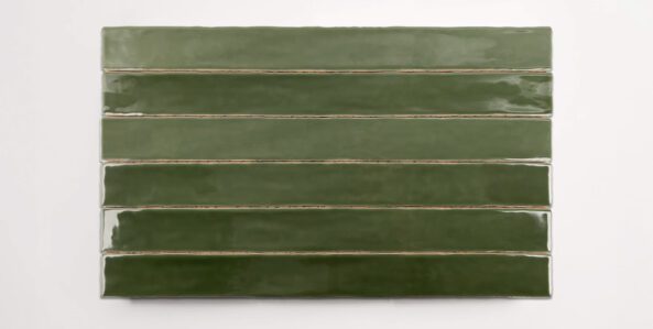 Six stacked 2" x 20" ceramic tiles in a dark green color