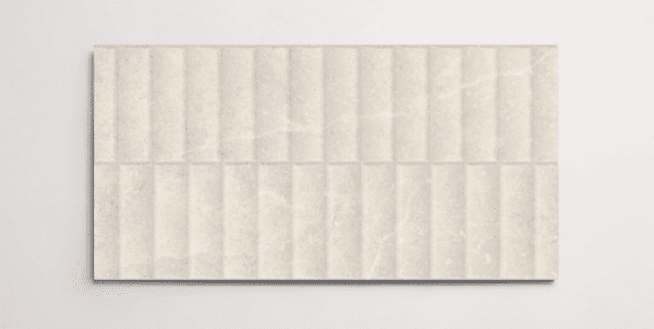 A single cream 10" x 30" stone-like porcelain tile with a textured blind pattern and subtle veining