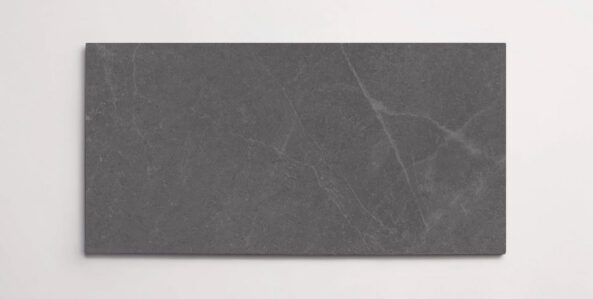 A single dark grey 10" x 30" stone-like porcelain tile with subtle veining