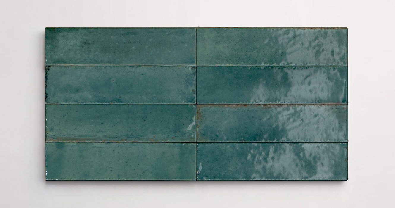 Nasco Stone + TIle's Flatiron Turquoise decorative wall tiles stacked together to show the subtle variations in texture and hue.